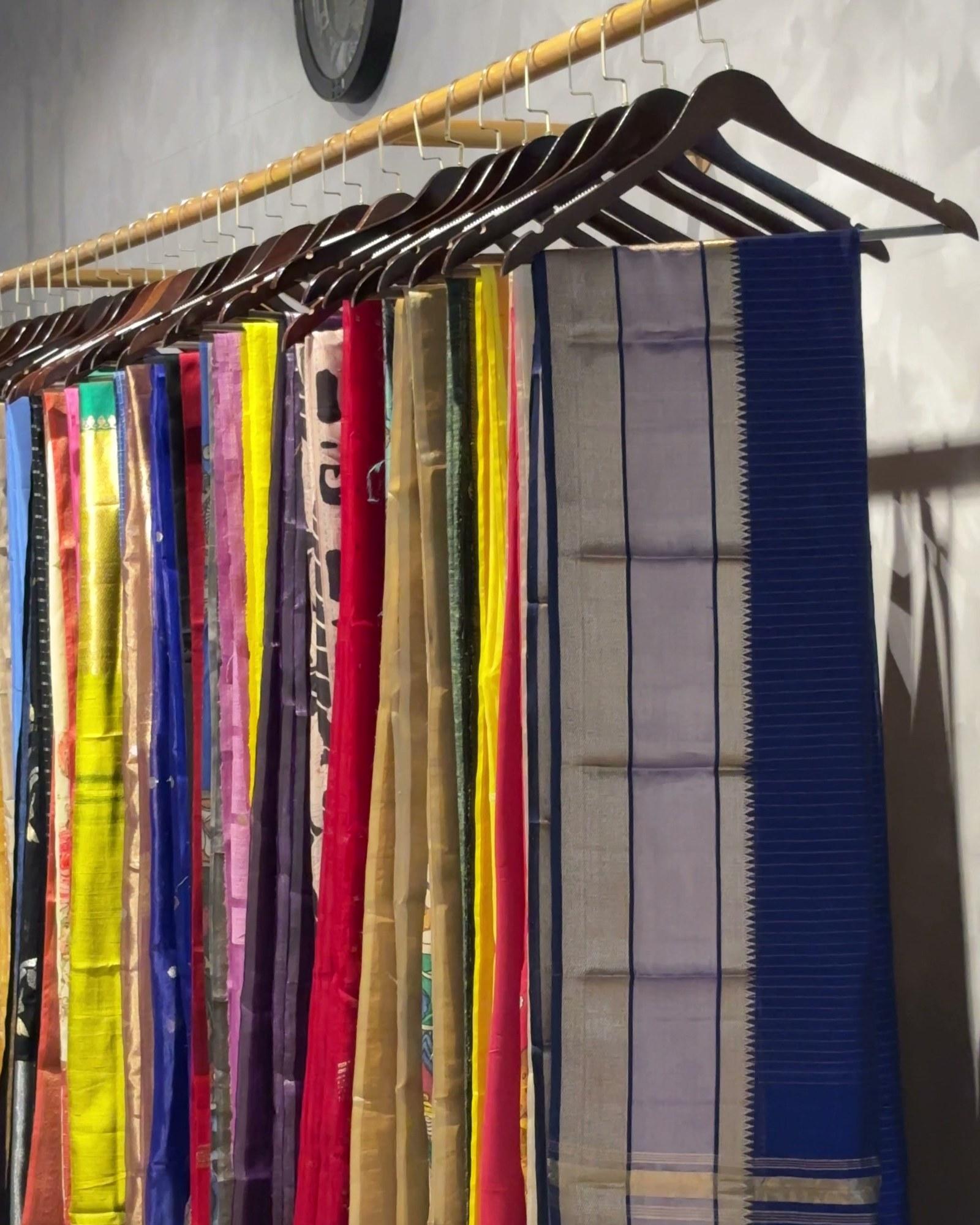 A rail of handwoven sarees in the Watermelon Woven showroom