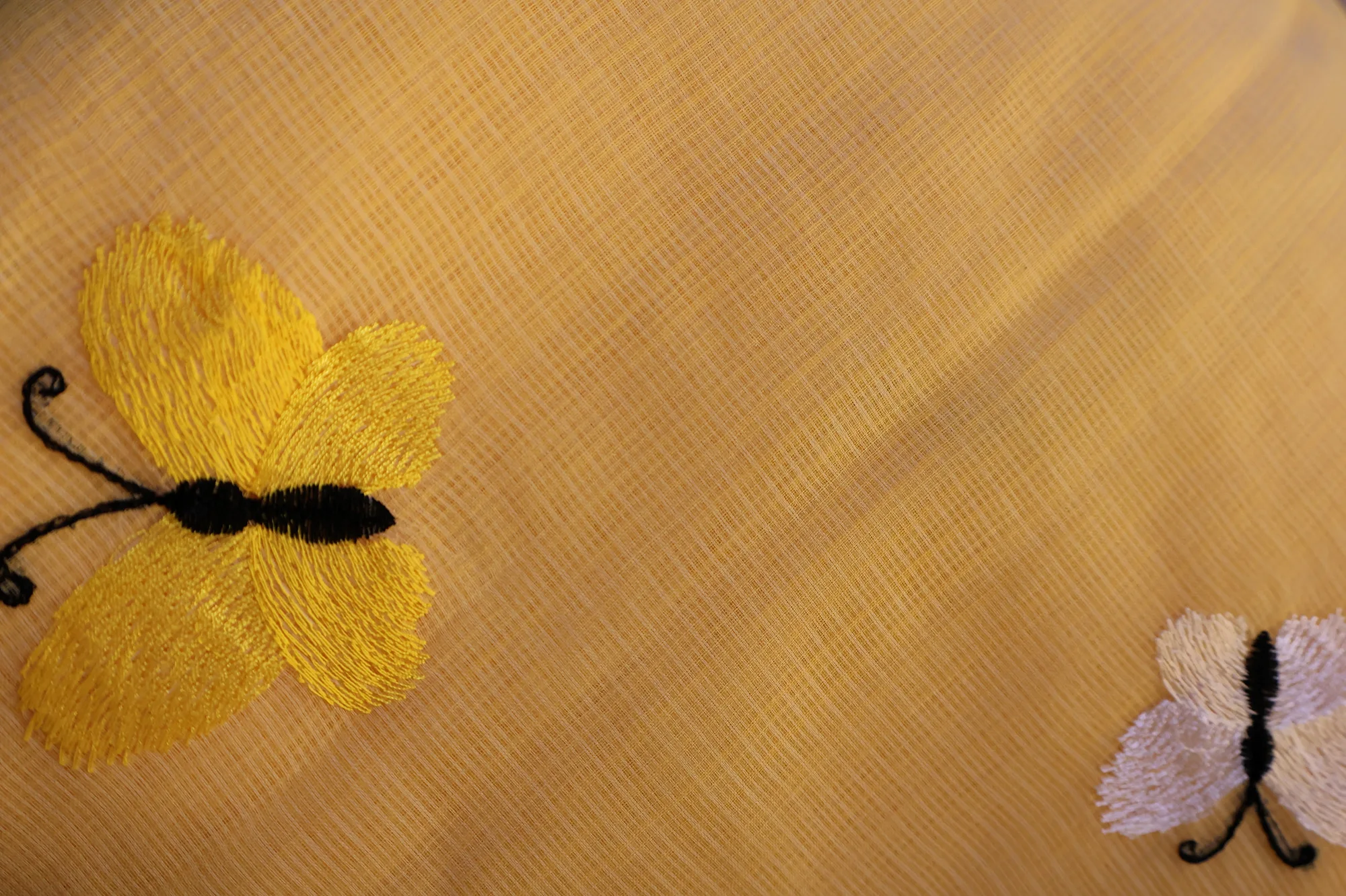 Butterfly Bloom - Kota: a detail of the work. Kota cotton.