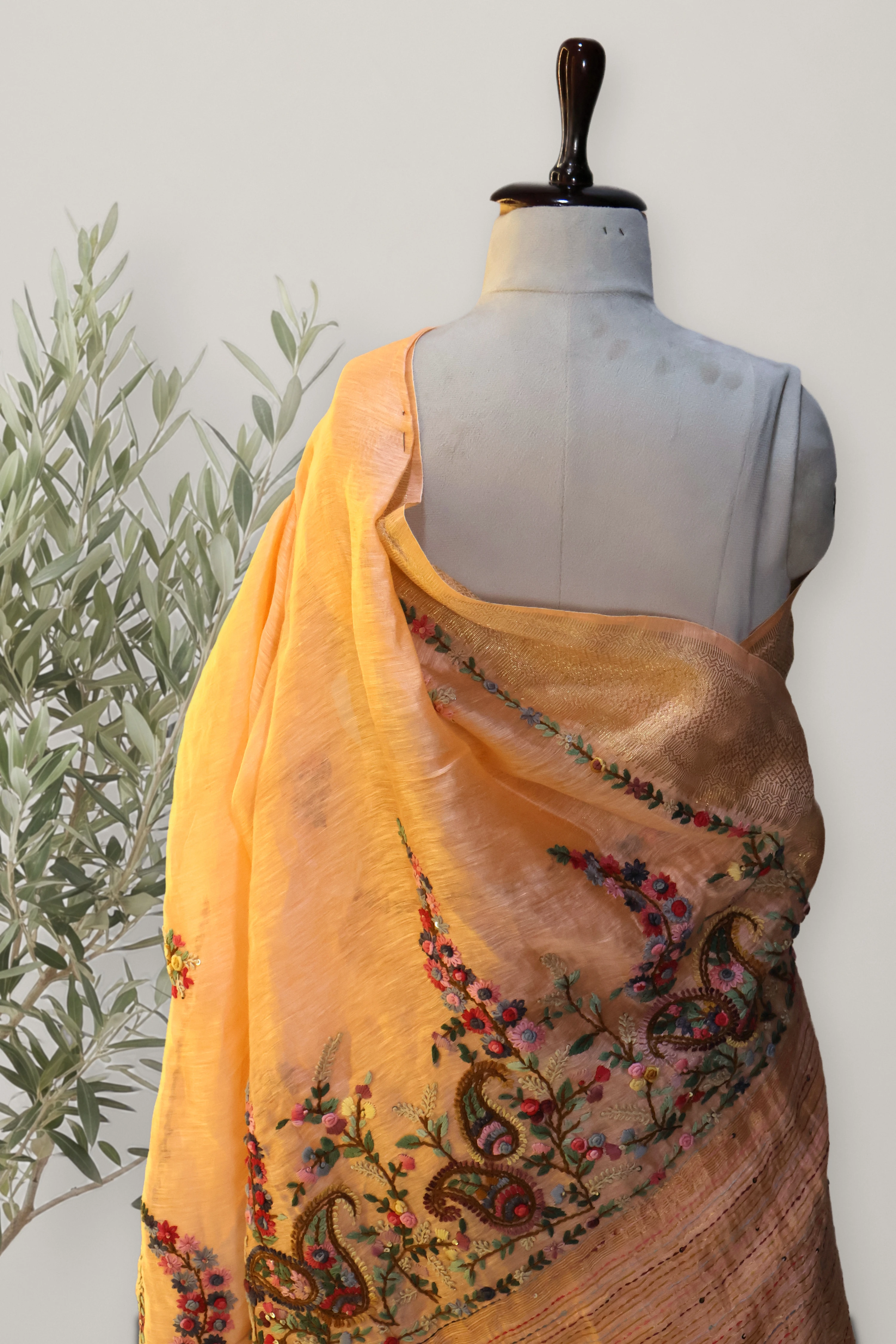 Gulnar Peach Tissue Linen Saree: a detail of the work. Tissue Linen.