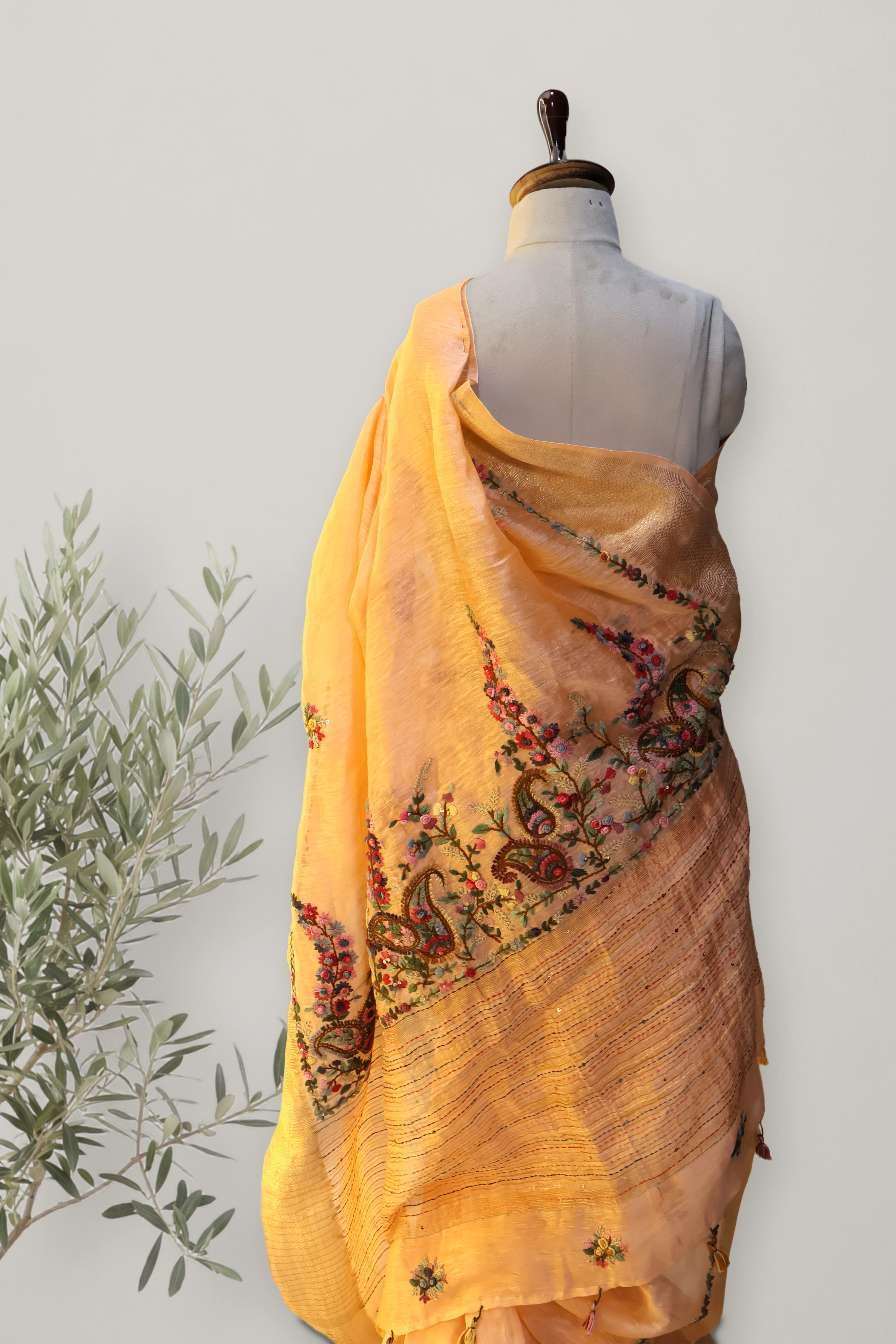 Gulnar Peach Tissue Linen Saree: a detail of the work. Tissue Linen.