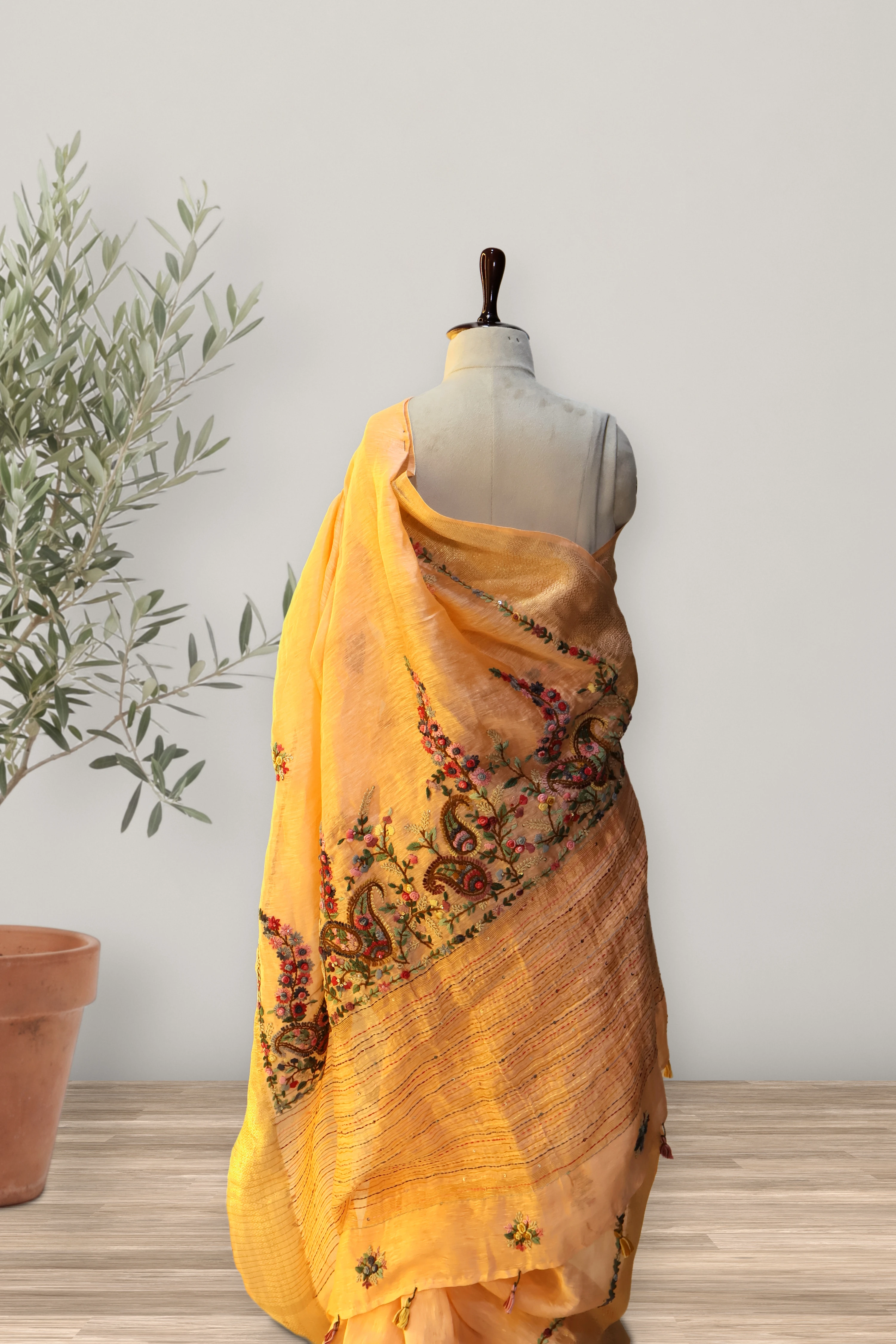 Gulnar Peach Tissue Linen Saree: a detail of the work. Tissue Linen.