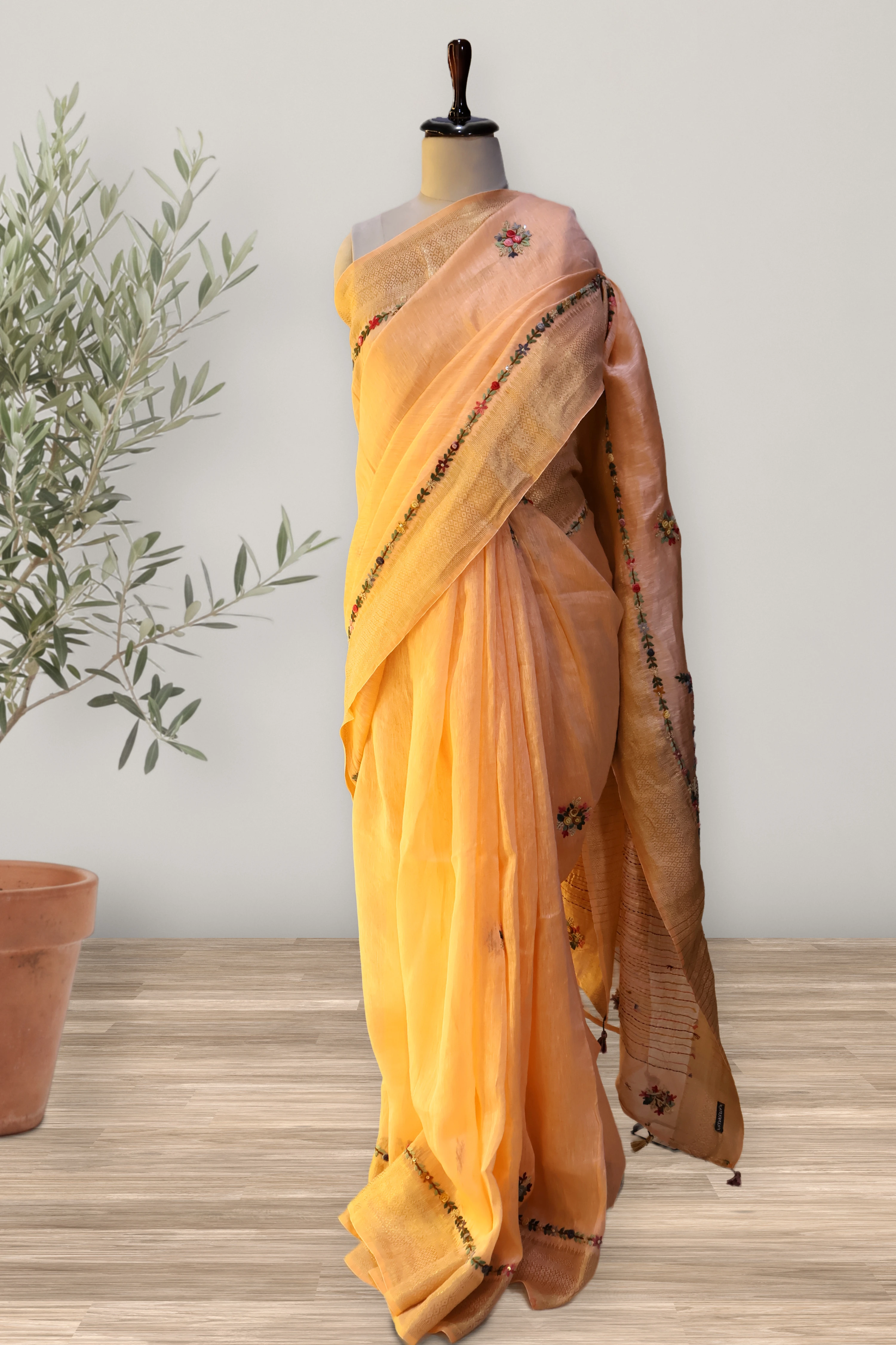 Gulnar Peach Tissue Linen Saree: a detail of the work. Tissue Linen.