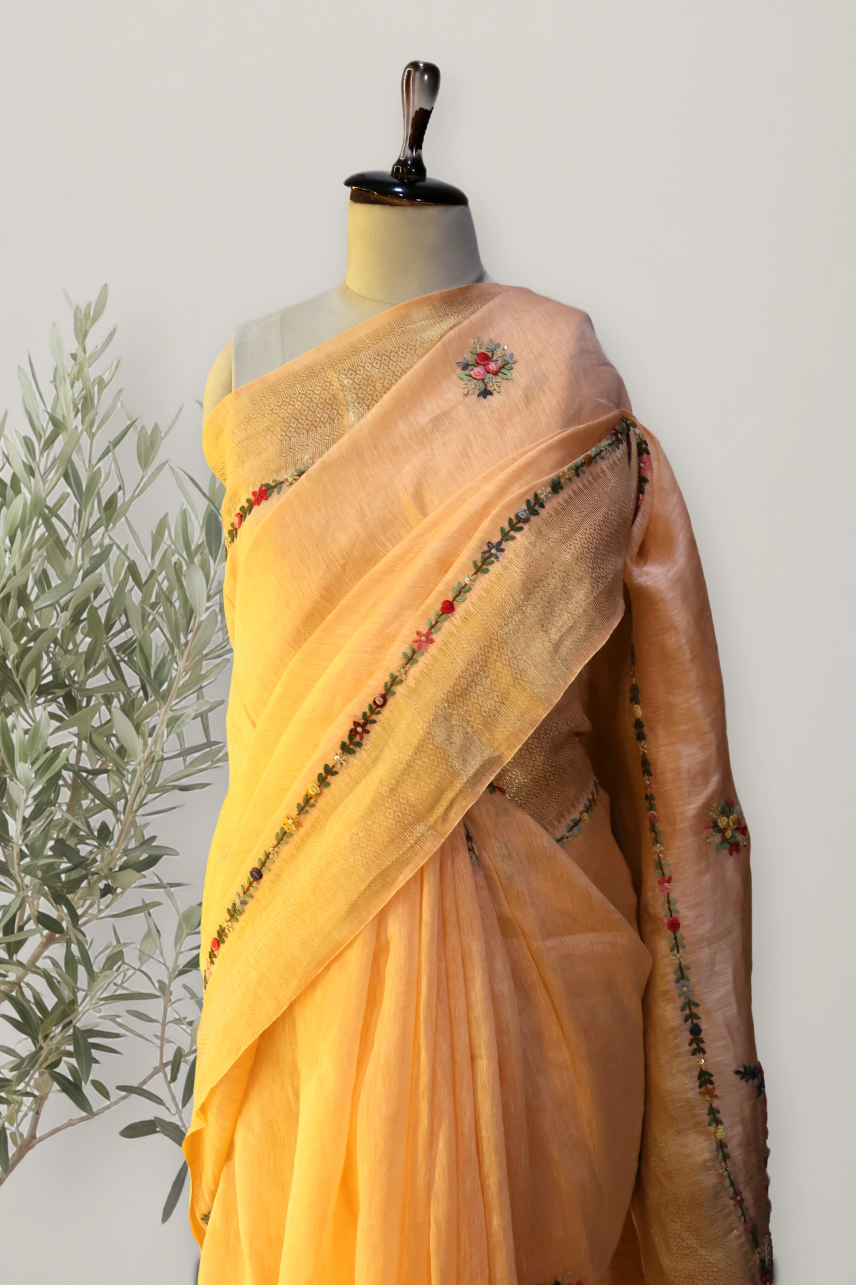 Gulnar Peach Tissue Linen Saree: the whole piece, laid out. Tissue Linen.
